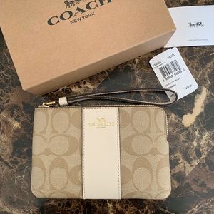 Light khaki coach wristlet . New never used